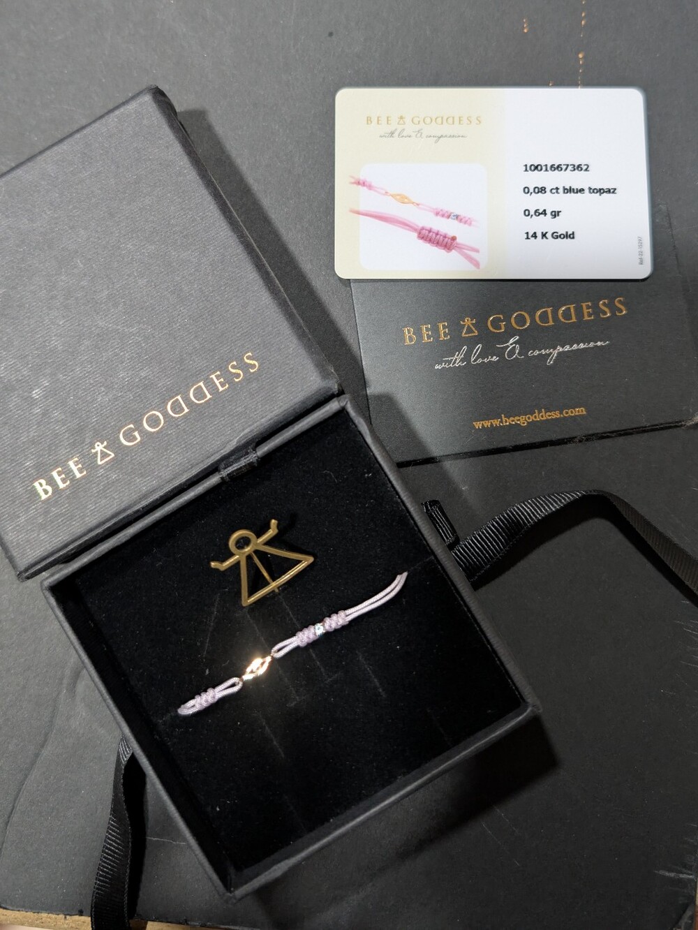 Bee Goddess 14k gold blue topaz on light purple cord bracelet with authenticity